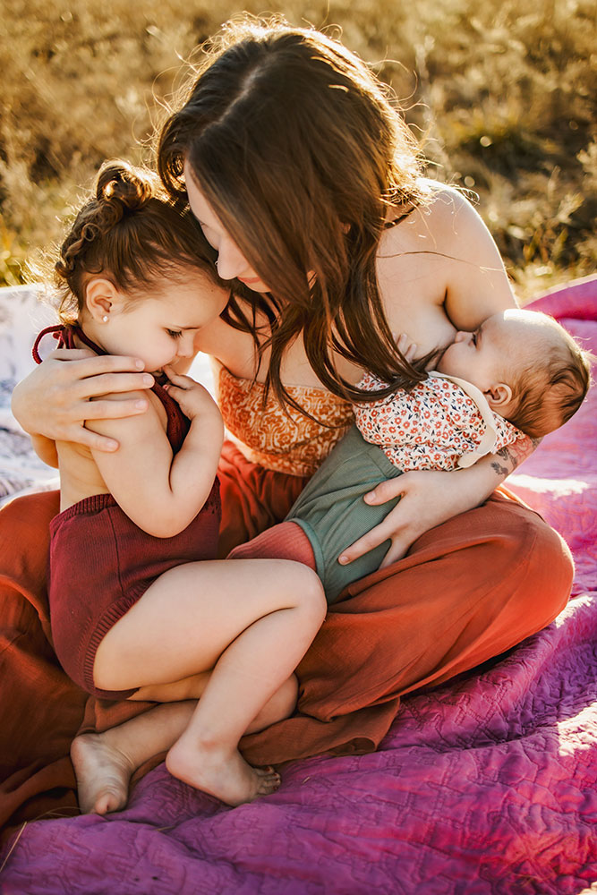 Mom comforts a toddler in Mckinney Texas at Erwinn Park.