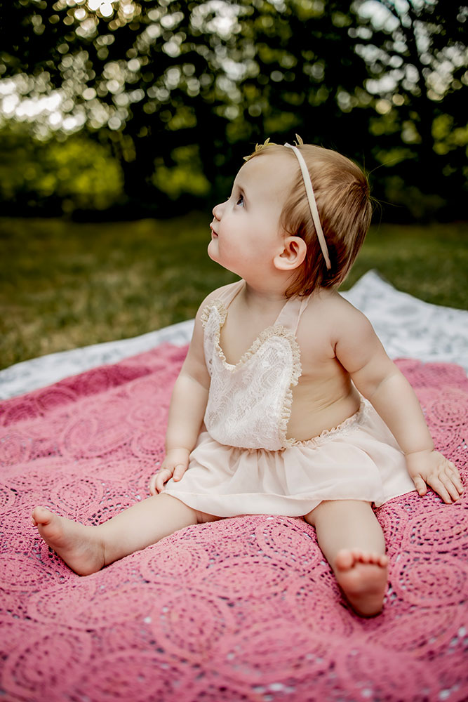 Baby's first birthday pictures on a blanket in Carrollton,Texas.