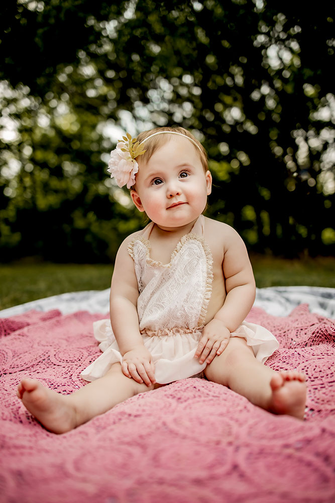 Baby's first birthday pictures on a blanket in Carrollton,Texas.