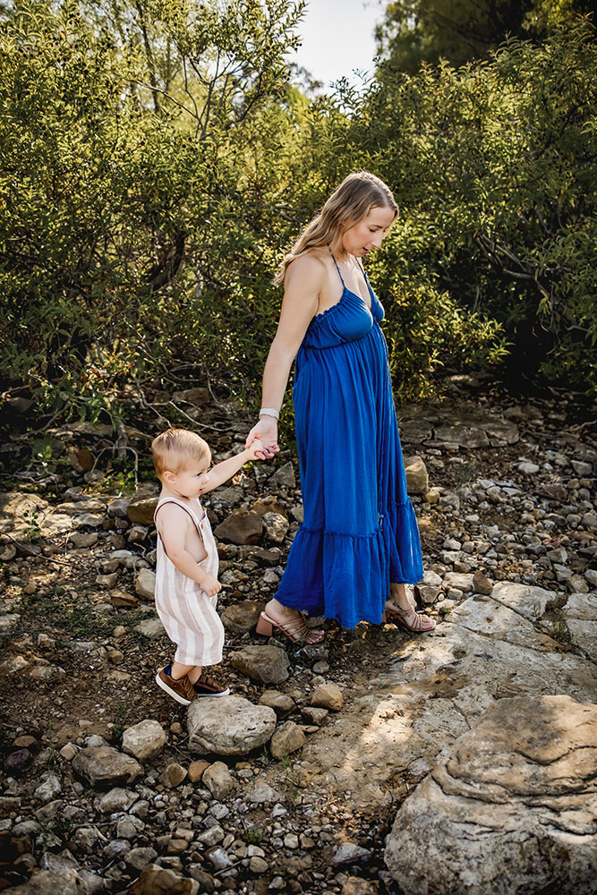 A mom walks with her son at a family photo session in Grapevine, Texas.