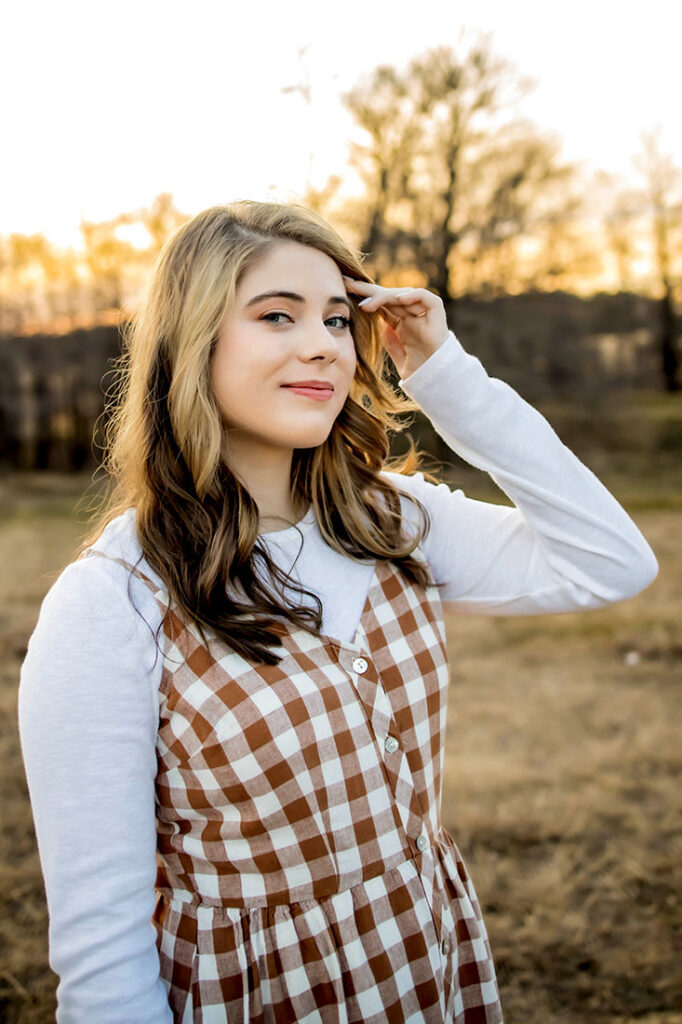 A senior girl from Plano Texas poses for her pictures in Flower Mound, TX.