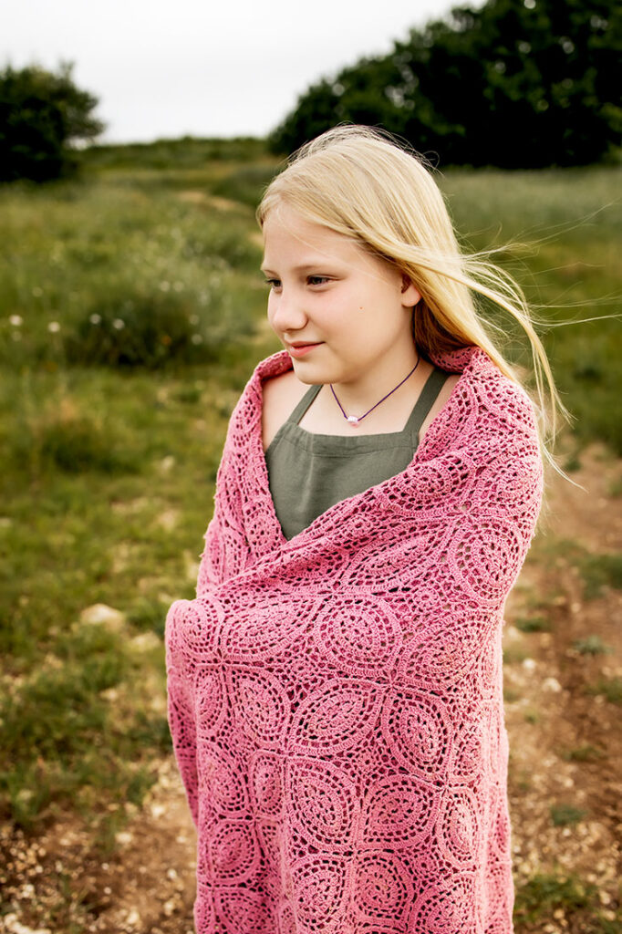 Young girl from Carrollton, TX walks in a field of wild flowers in Plano, TX at Arbor Hills Nature Preserve.