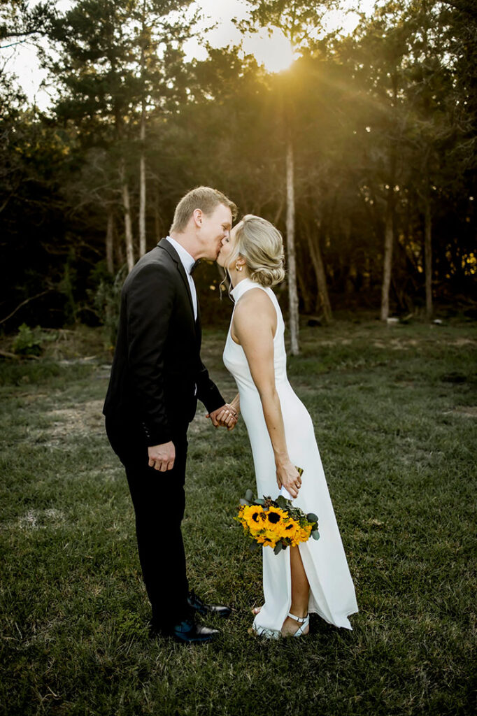 A bride and groom kiss in Plano Texa.