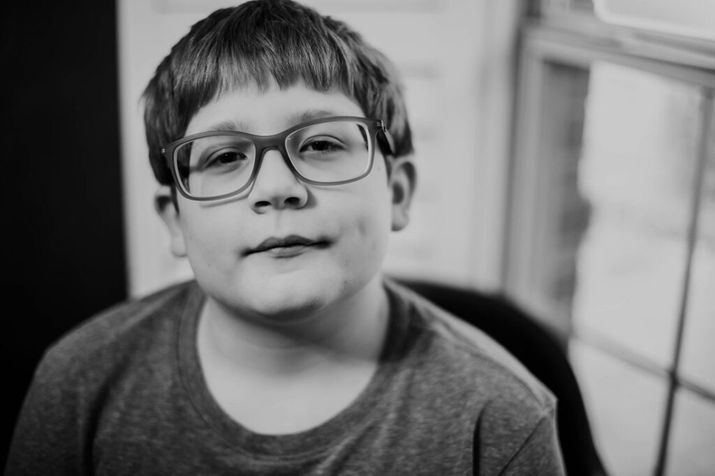 black and white image of a young boy in Castle Hills neighborhood DFW.